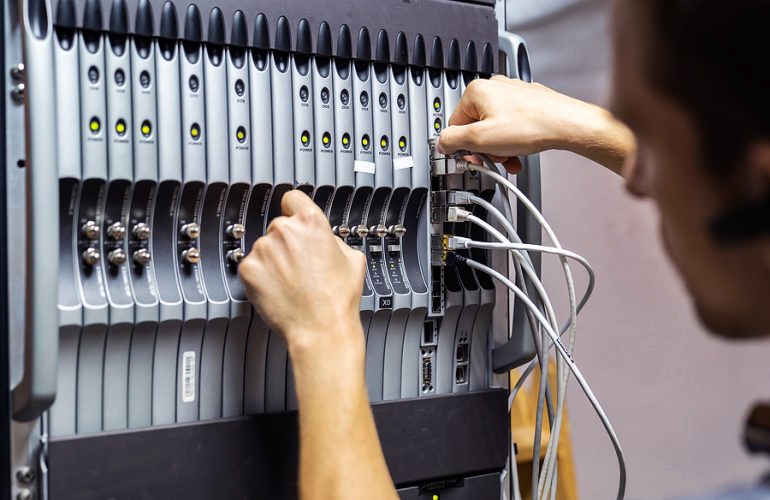 IT worker fixing a connection